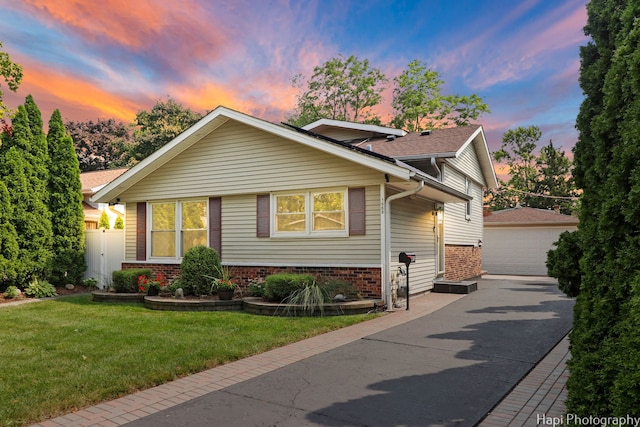 1569 Sherman Pl, Des Plaines, IL 60016 - view of front of property with brick siding, an outbuilding, a garage, and a yard