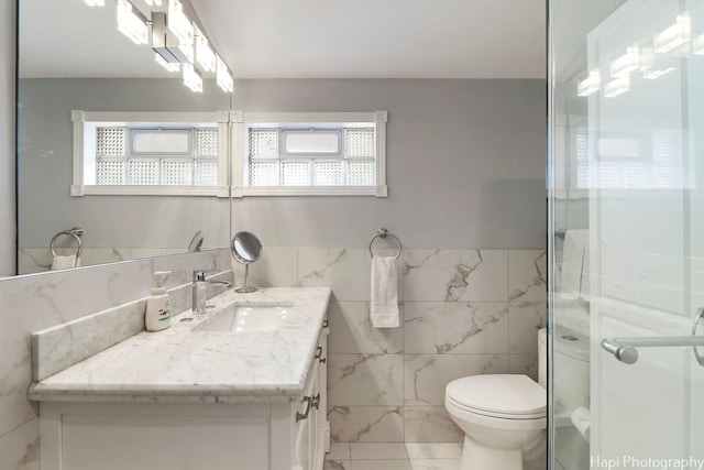 1569 Sherman Pl, Des Plaines, IL 60016 - full bathroom with tile walls, vanity, and a shower stall