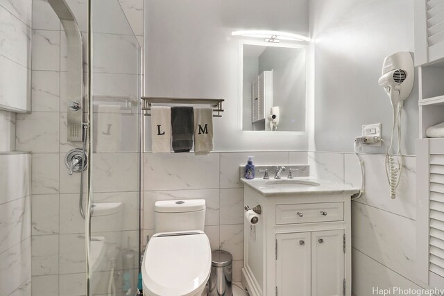 1569 Sherman Pl, Des Plaines, IL 60016 - bathroom featuring tile walls, vanity, and a shower stall