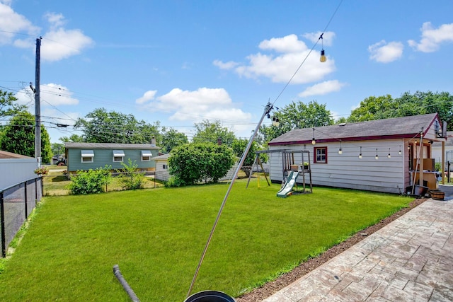 733 Ashland Ave, Chicago Heights, IL 60411 - fenced backyard featuring a playground