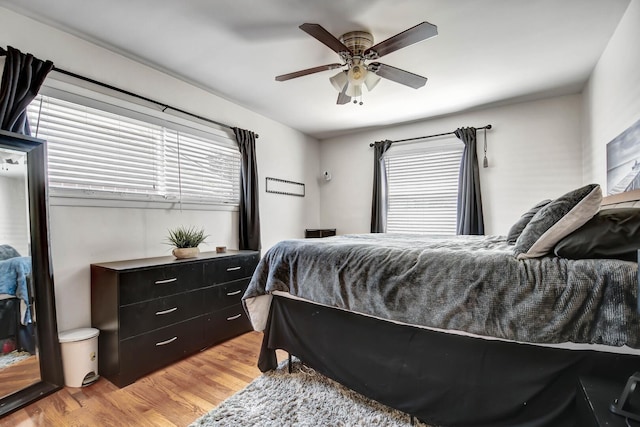733 Ashland Ave, Chicago Heights, IL 60411 - bedroom with light wood finished floors, multiple windows, and ceiling fan
