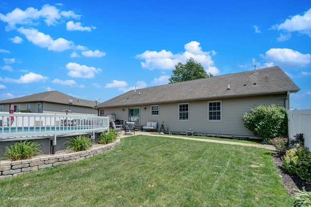1245 Patriot Way, Bourbonnais, IL 60914 - rear view of property featuring a wooden deck, an outdoor pool, and roof with shingles