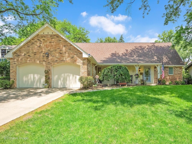 262 Sheffield Ln, Glen Ellyn, IL 60137 - view of front of home featuring brick siding, a garage, a front lawn, and concrete driveway