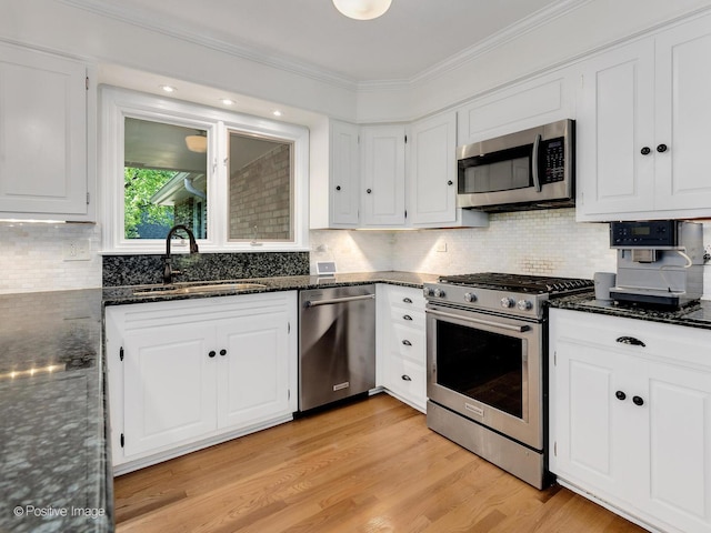 262 Sheffield Ln, Glen Ellyn, IL 60137 - kitchen featuring stainless steel appliances, white cabinetry, dark stone countertops, crown molding, and decorative backsplash