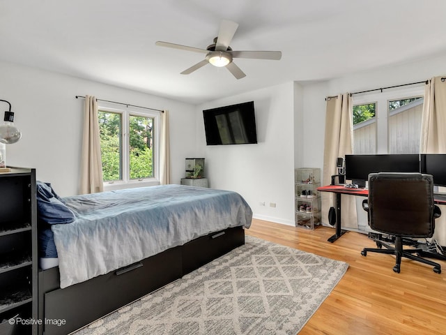 262 Sheffield Ln, Glen Ellyn, IL 60137 - bedroom featuring multiple windows, wood finished floors, an office area, and a ceiling fan