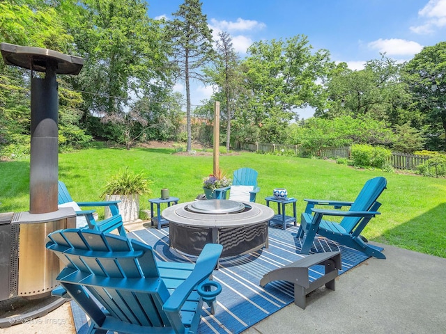 262 Sheffield Ln, Glen Ellyn, IL 60137 - fenced backyard with a fire pit, a patio, and view of wooded area