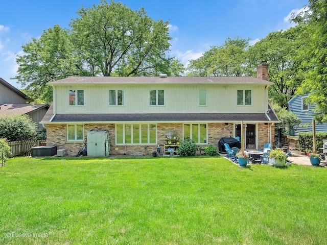 262 Sheffield Ln, Glen Ellyn, IL 60137 - back of house with a chimney, a patio area, and brick siding