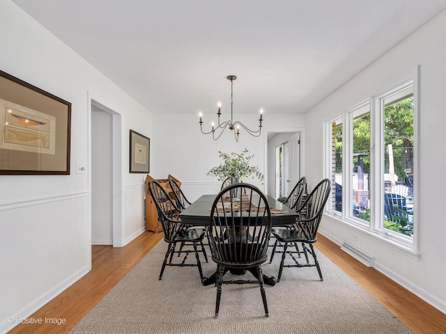 262 Sheffield Ln, Glen Ellyn, IL 60137 - dining room with plenty of natural light, a chandelier, and light wood finished floors