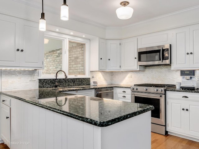 262 Sheffield Ln, Glen Ellyn, IL 60137 - kitchen with stainless steel appliances, white cabinets, dark stone countertops, crown molding, and tasteful backsplash