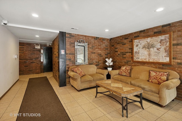 9331 Landings Ln Unit 204, Des Plaines, IL 60016 - living area with brick wall, light tile patterned floors, and recessed lighting