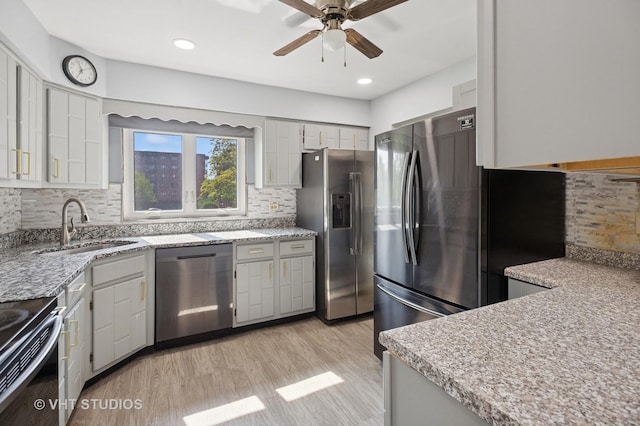 9331 Landings Ln Unit 204, Des Plaines, IL 60016 - kitchen with stainless steel appliances, a ceiling fan, tasteful backsplash, light wood-style floors, and recessed lighting