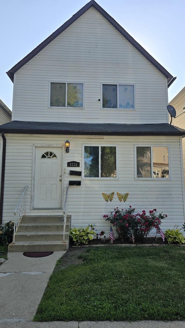 1233 Otto Blvd, Chicago Heights, IL 60411 - view of front of property featuring entry steps and a front lawn