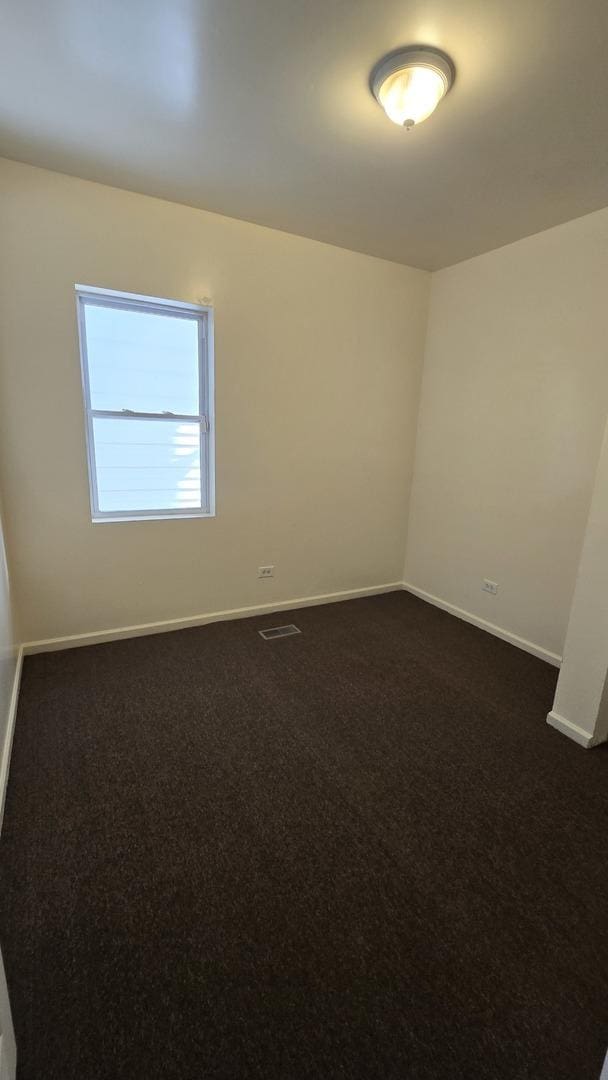 1233 Otto Blvd, Chicago Heights, IL 60411 - spare room featuring dark colored carpet
