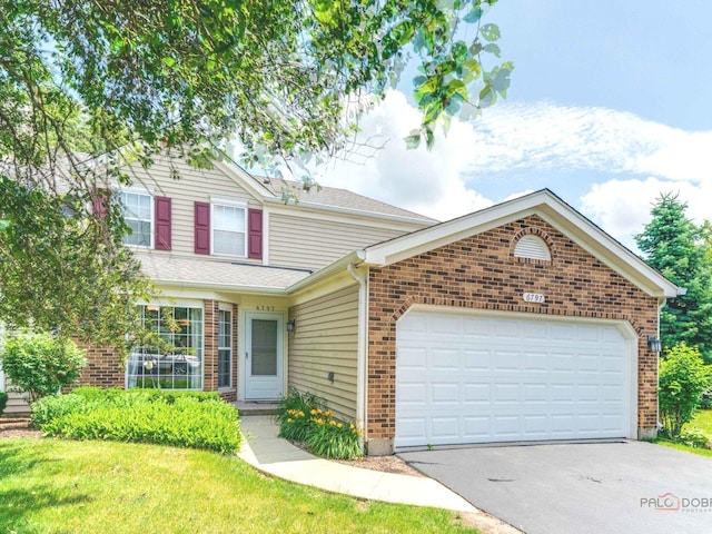 6797 Roanoake Ct, Gurnee, IL 60031 - traditional-style home featuring brick siding, asphalt driveway, a garage, and a front lawn