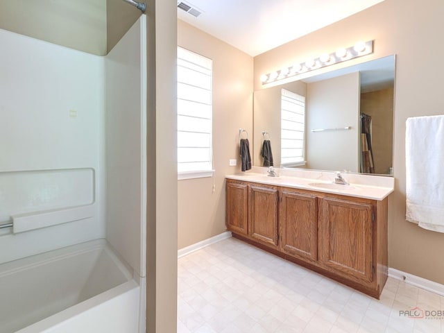 6797 Roanoake Ct, Gurnee, IL 60031 - bathroom featuring double vanity and  shower combination