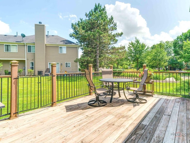 6797 Roanoake Ct, Gurnee, IL 60031 - wooden terrace featuring outdoor dining space and a yard