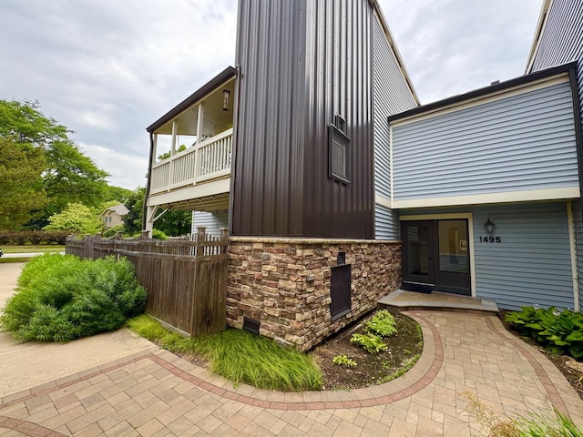 1495 S County Farm Rd Unit 2-4, Wheaton, IL 60189 - view of side of property with stone siding and a balcony