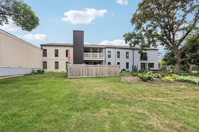1495 S County Farm Rd Unit 2-4, Wheaton, IL 60189 - rear view of house featuring a chimney and a yard
