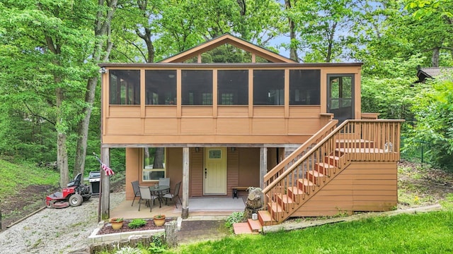 131 Shawnee Ln, Loda, IL 60948 - back of house with a sunroom, a patio, and stairs