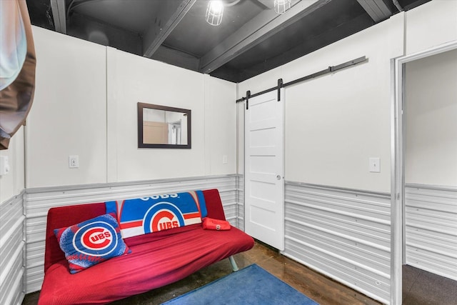 131 Shawnee Ln, Loda, IL 60948 - living area featuring a barn door, a wainscoted wall, and concrete floors