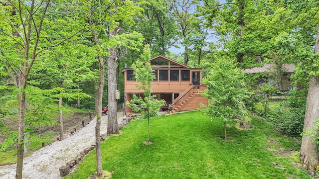 131 Shawnee Ln, Loda, IL 60948 - view of front of home featuring a sunroom, stairs, and a front lawn