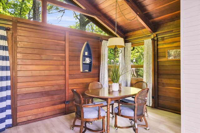 131 Shawnee Ln, Loda, IL 60948 - dining space with wood walls, light wood-style flooring, and wooden ceiling