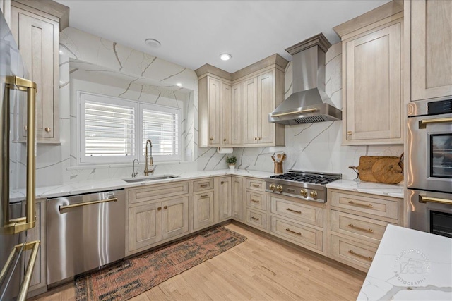 0N423 Armstrong Ln, Geneva, IL 60134 - kitchen with stainless steel appliances, wall chimney exhaust hood, tasteful backsplash, light wood-type flooring, and light stone countertops