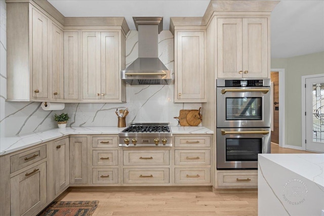 0N423 Armstrong Ln, Geneva, IL 60134 - kitchen with appliances with stainless steel finishes, extractor fan, light wood-style floors, backsplash, and light stone countertops