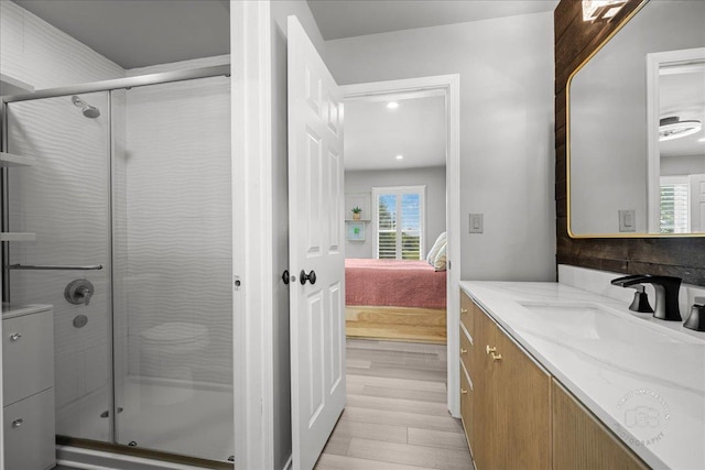 0N423 Armstrong Ln, Geneva, IL 60134 - full bathroom with connected bathroom, vanity, a stall shower, wood finished floors, and recessed lighting