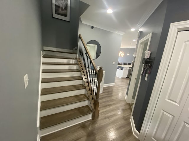 7009 W Crandall Ave, Worth, IL 60482 - stairs featuring ornamental molding, wood finished floors, and recessed lighting