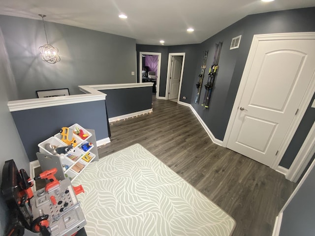 7009 W Crandall Ave, Worth, IL 60482 - rec room featuring dark wood-style floors, recessed lighting, and lofted ceiling