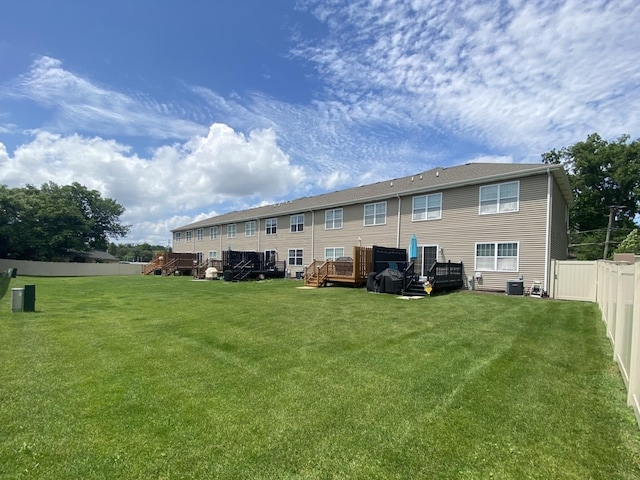 7009 W Crandall Ave, Worth, IL 60482 - back of property with a fenced backyard and a deck