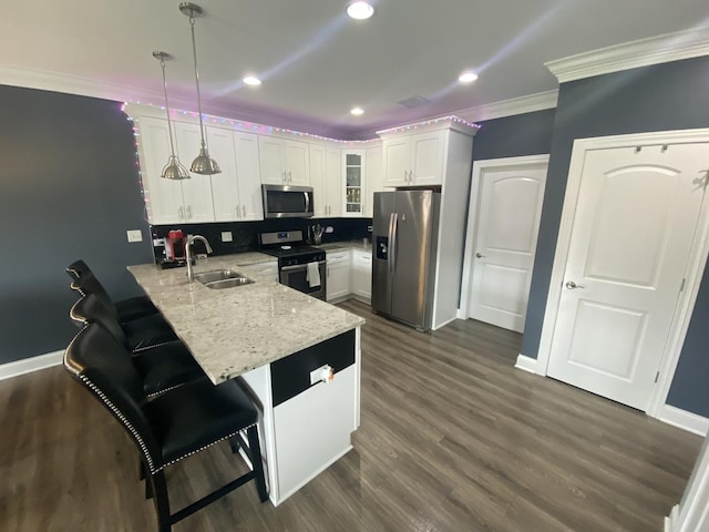 7009 W Crandall Ave, Worth, IL 60482 - kitchen with stainless steel appliances, ornamental molding, a peninsula, glass insert cabinets, and white cabinetry