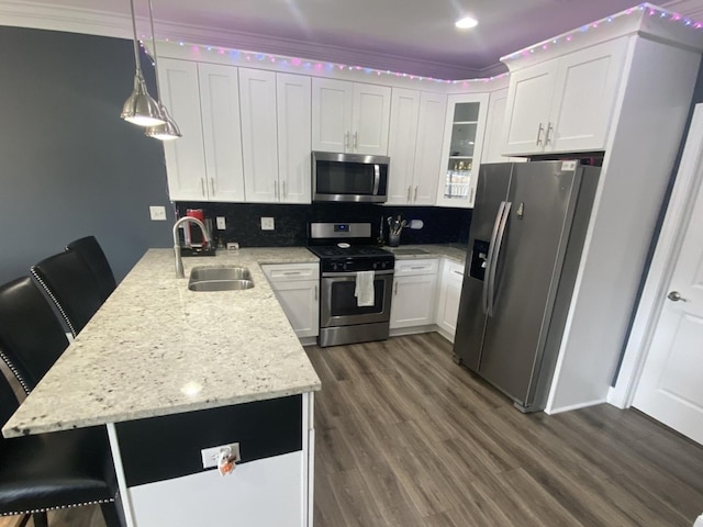 7009 W Crandall Ave, Worth, IL 60482 - kitchen featuring stainless steel appliances, a peninsula, dark wood-style floors, glass insert cabinets, and decorative backsplash