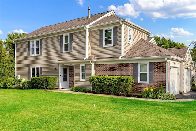 1801 Pebble Beach Cir Unit 1, Elk Grove Village, IL 60007 - view of front of home featuring an attached garage, a front yard, brick siding, roof with shingles, and asphalt driveway