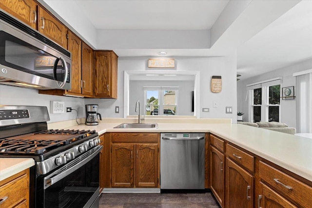 1801 Pebble Beach Cir Unit 1, Elk Grove Village, IL 60007 - kitchen featuring appliances with stainless steel finishes, light countertops, and brown cabinets