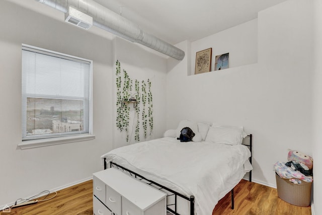 1000 E 53rd St Unit 501, Chicago, IL 60615 - bedroom with wood finished floors and baseboards