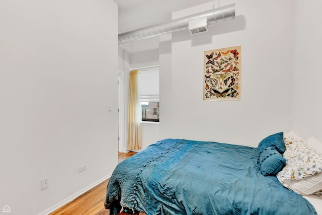1000 E 53rd St Unit 501, Chicago, IL 60615 - bedroom with light wood-style floors and baseboards