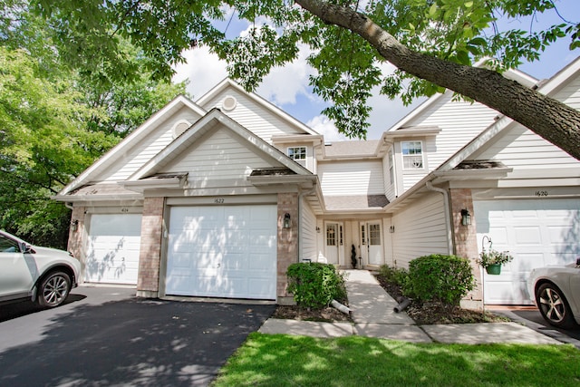 1622 Orchard Ave, Schaumburg, IL 60193 - view of front of property with asphalt driveway, a garage, and brick siding