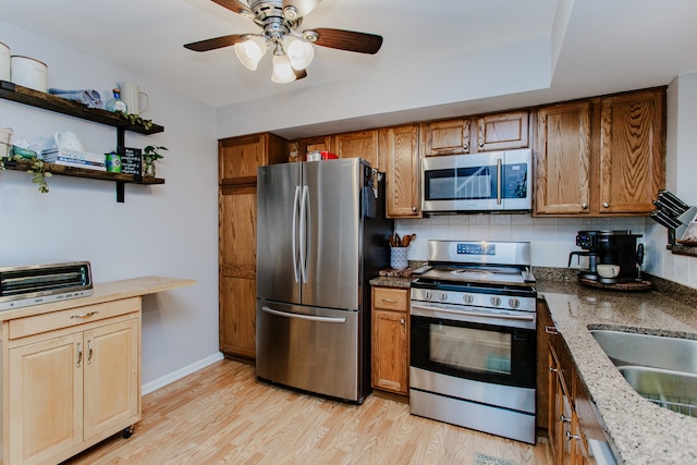 1622 Orchard Ave, Schaumburg, IL 60193 - kitchen with appliances with stainless steel finishes, a ceiling fan, decorative backsplash, light wood-style floors, and open shelves