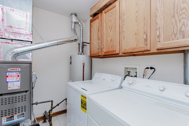 1622 Orchard Ave, Schaumburg, IL 60193 - laundry room featuring washer and dryer, gas water heater, cabinet space, and light tile patterned floors