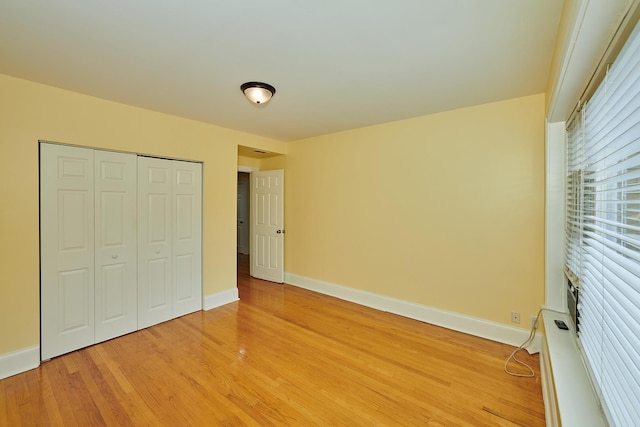 6333 N Francisco Ave Unit 2, Chicago, IL 60659 - unfurnished bedroom featuring light wood-style floors and a closet