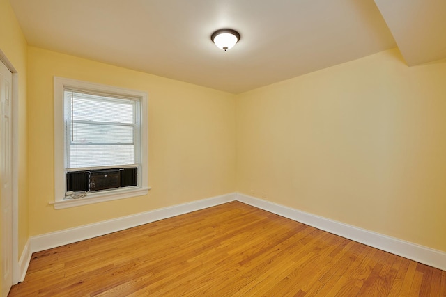6333 N Francisco Ave Unit 2, Chicago, IL 60659 - spare room with cooling unit and light wood-style floors
