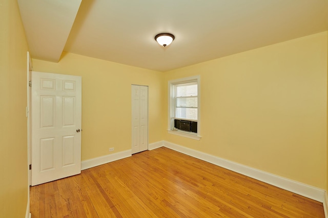 6333 N Francisco Ave Unit 2, Chicago, IL 60659 - unfurnished bedroom with light wood finished floors, a closet, and cooling unit