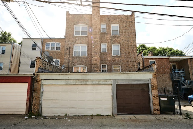 6333 N Francisco Ave Unit 2, Chicago, IL 60659 - rear view of property featuring brick siding and a garage