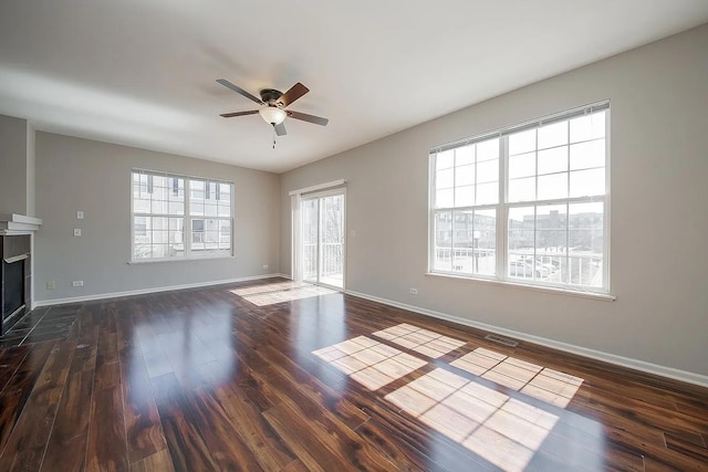 4199 Milford Ln Unit 4199, Aurora, IL 60504 - unfurnished living room featuring ceiling fan, dark wood-style flooring, and a fireplace with flush hearth