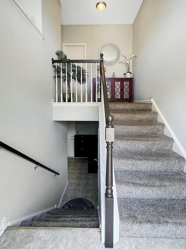 4199 Milford Ln Unit 4199, Aurora, IL 60504 - stairs featuring tile patterned floors and baseboards