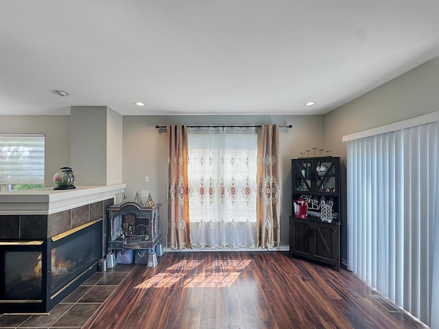 4199 Milford Ln Unit 4199, Aurora, IL 60504 - living area featuring healthy amount of natural light, a fireplace, wood finished floors, and recessed lighting