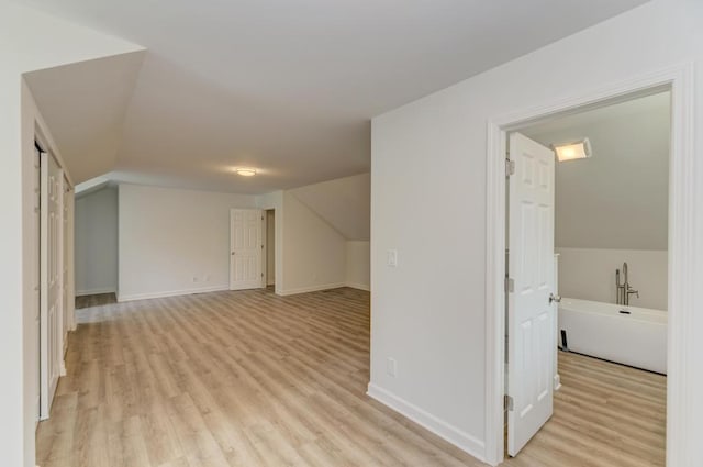 1927 Lakewood Dr, Wilmington, IL 60481 - bonus room with light wood-style flooring and lofted ceiling