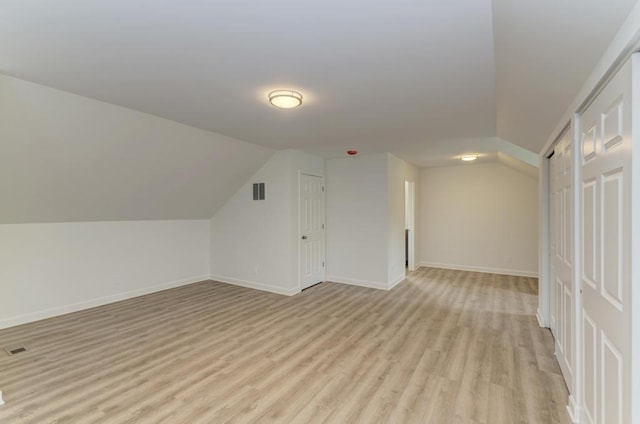 1927 Lakewood Dr, Wilmington, IL 60481 - additional living space with light wood-type flooring and vaulted ceiling